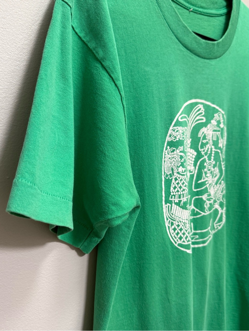 Vintage Green Graphic Tee with White Aztec-Style Print